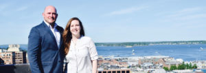 Two People on Rooftop with Portland, ME Waterfront in Background