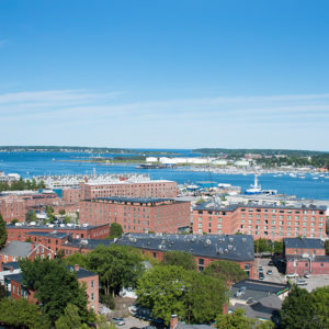Waterfront Location of Downtown Portland, ME Hotel with Ocean, Buildings and Boats in Background