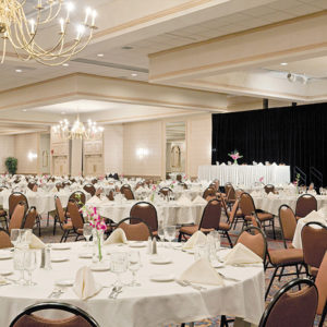 Tables with Beige Table Cloths in Grand Ballroom at Downtown Portland, ME Hotel