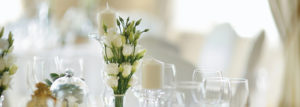 Table Centerpiece with White Flowers and Glassware at Portland, ME Wedding Venue