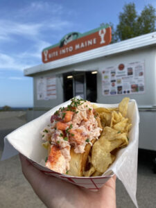 bite into maine lobster roll