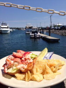 js oyster lobster roll and view of the harbor